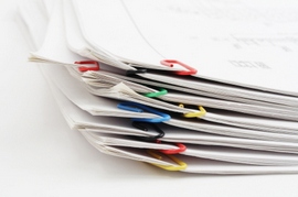 Pack of sheets of paper fastened by paper clips