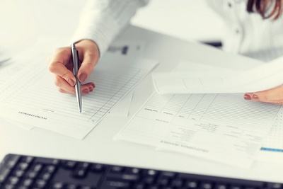 woman hand filling in blank paper or document