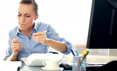 stock-footage-businesswoman-eating-lunch-in-the-office-and-signing-documents-2wni91vr75on1i3urw2x3e