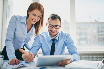 Image of two successful business partners working at meeting in